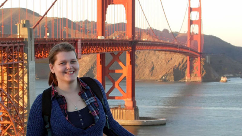 Rachel Kamal standing in front of the Golden Gate Bridge
