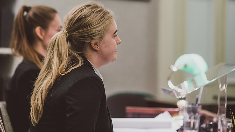 Female Legal Practice, LLM student practising in court on campus at Oxford Brookes University