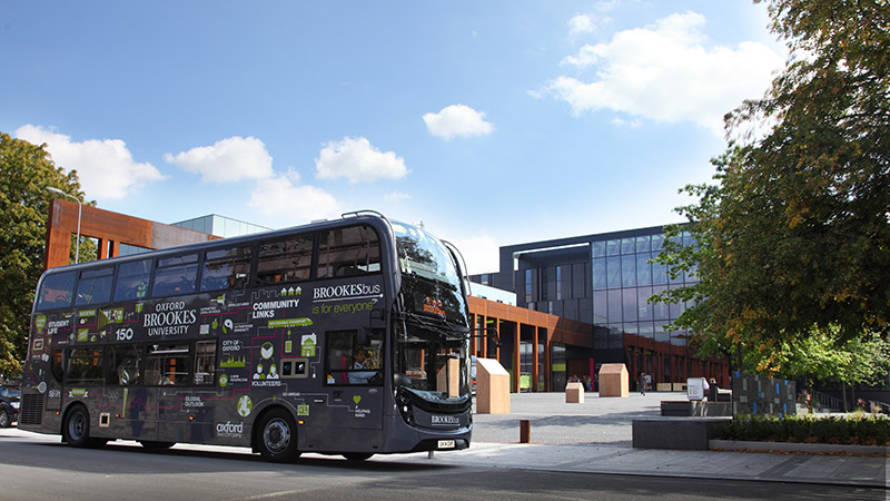 A picture of an Oxford Brookes bus in front of the Headington campus