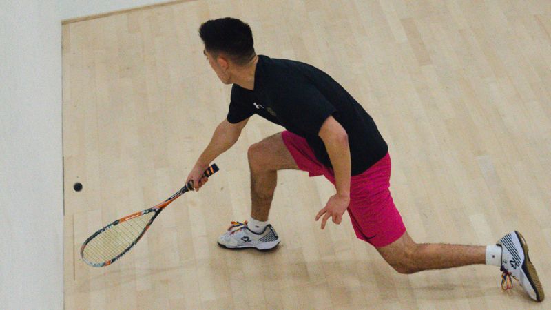 Student playing squash