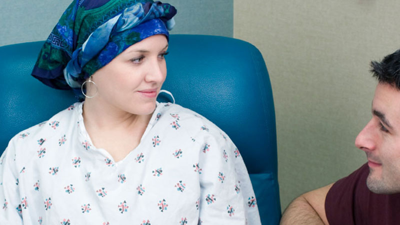 Nurse talking to cancer patient