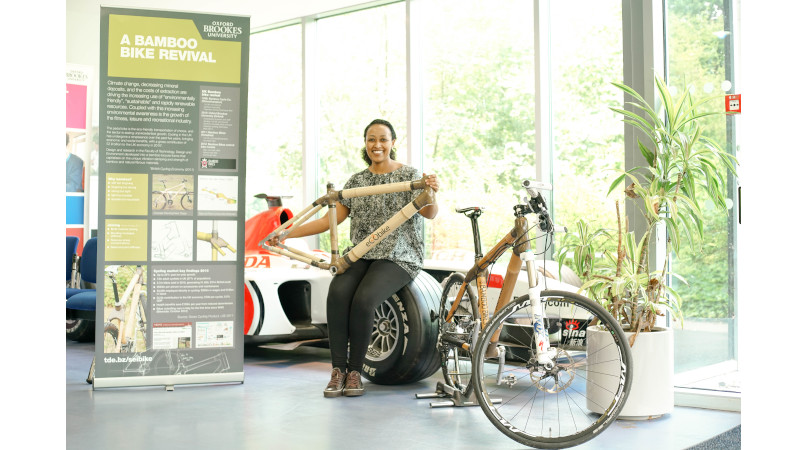 Mrs Ethiopia Wondimu displaying built frame and bike