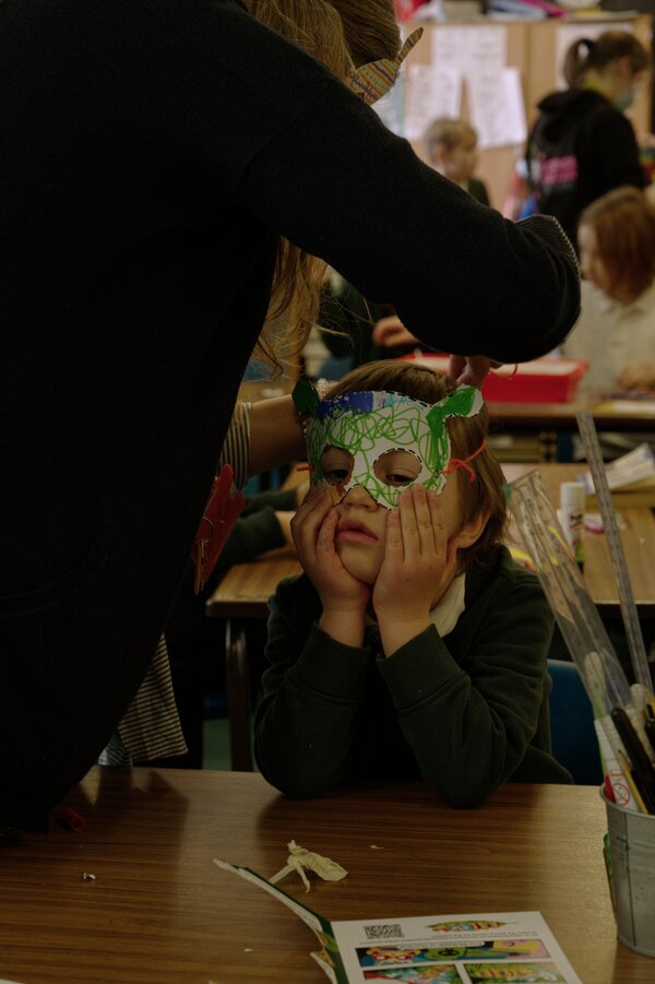 Pupil trying on a mask