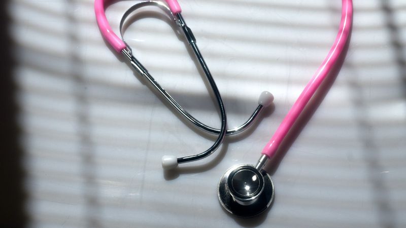 photo of stethoscope on a white table