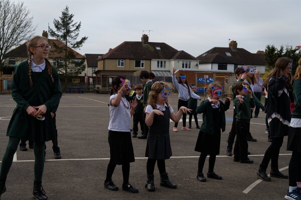 Pupils dancing in the playground