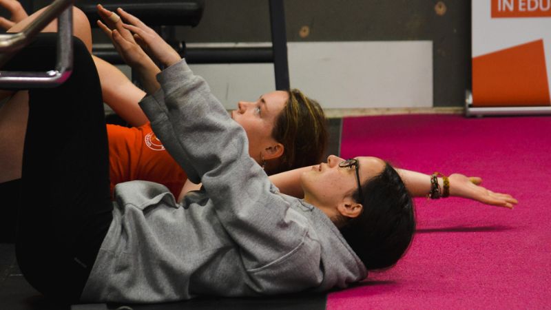 Two students stretching