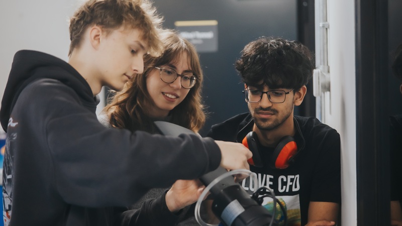Student taking pictures with a camera