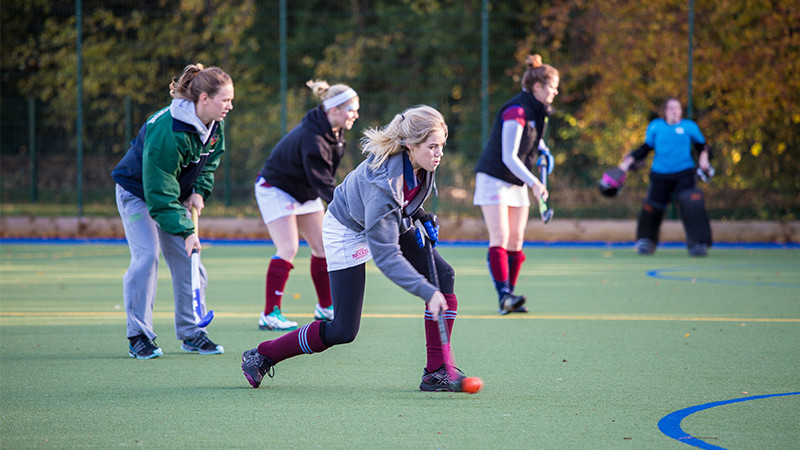 A group of students playing hockey