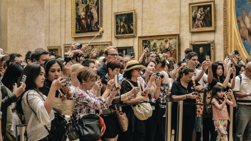 Tourist taking pictures in a museum