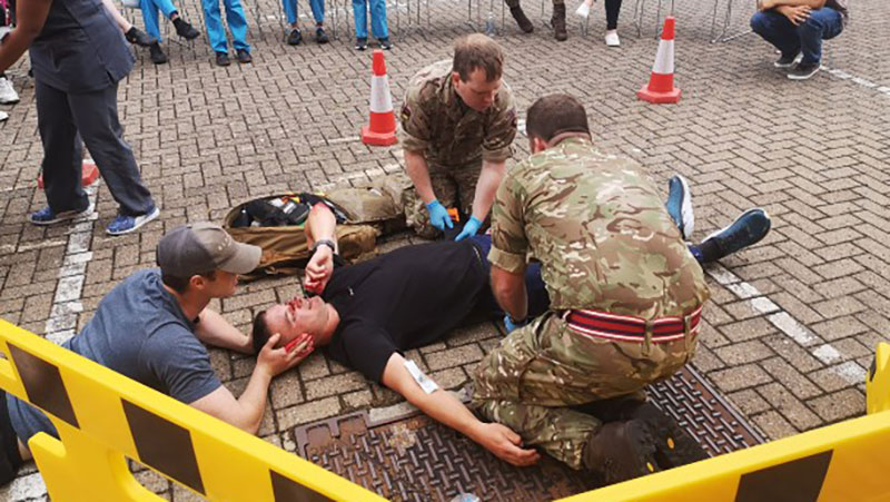 Military medics teach students emergency trauma care skills
