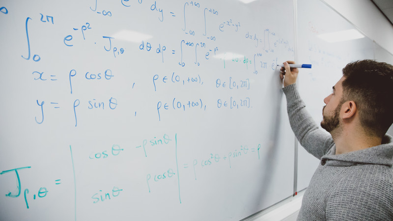Maths work on a whiteboard