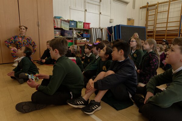 Children sat on floor listening