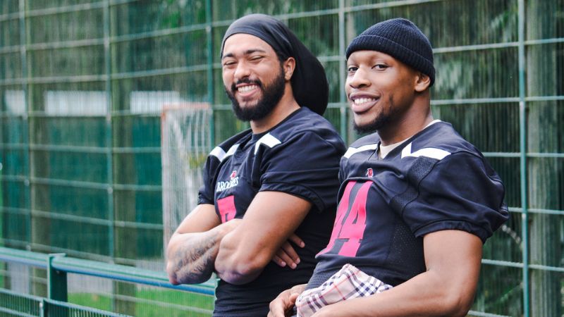 Two smiling American Football players