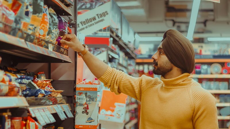 Man wearing turban browsing in a supermarket