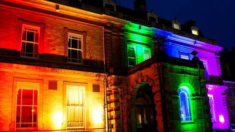 multi-coloured lights illuminating building
