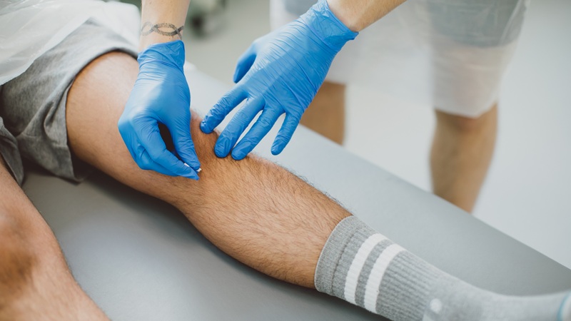 Nursing Studies Student taking blood sample from just below patients knee 