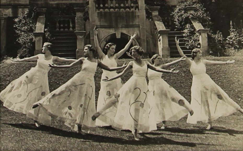 Group of Dorset House students in dance formation in the gardens of the School.