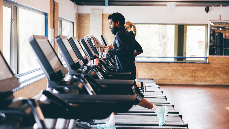 Gym user running on treadmill