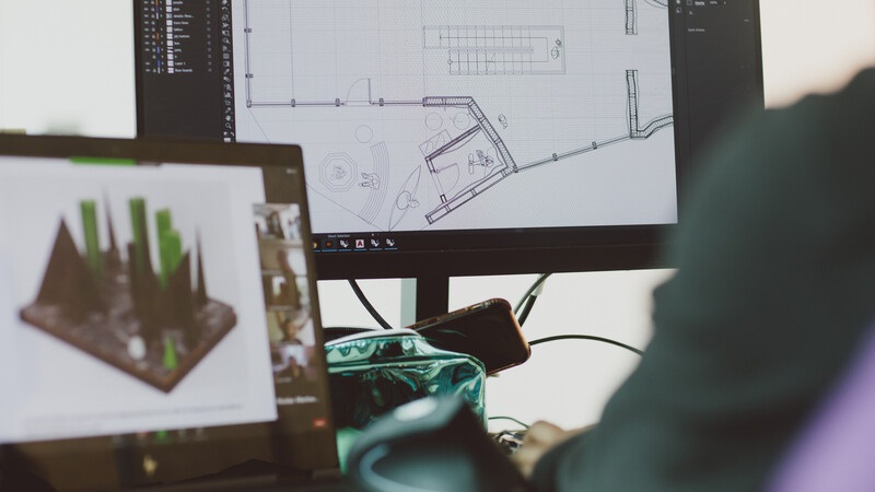 Student working on a computer on an architectural design