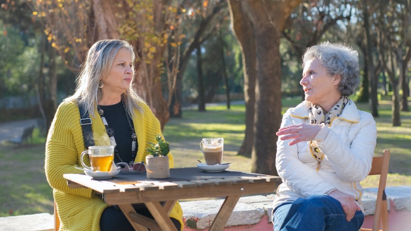 Two women talking over a cup of tea