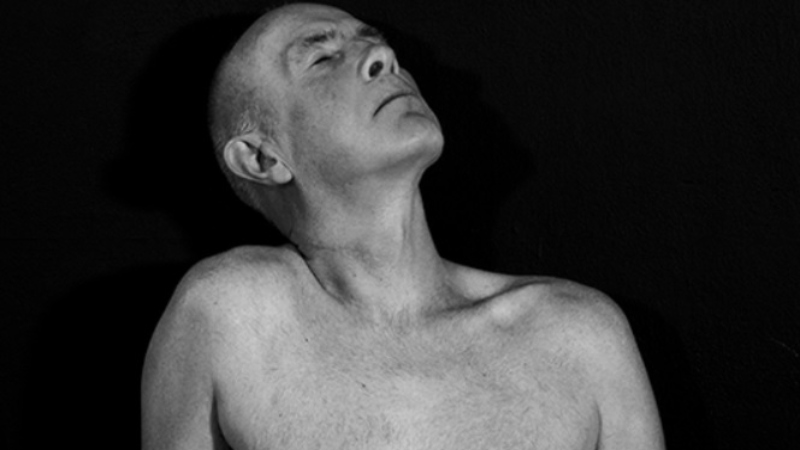 A nude man showing torso 