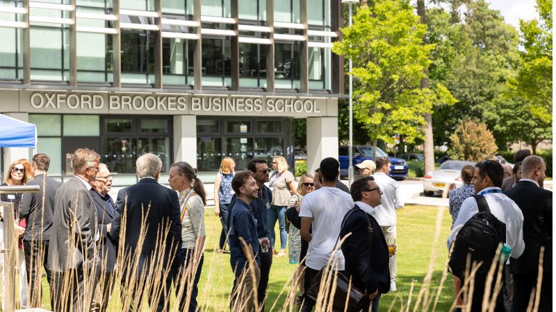 People milling around the Oxford Brookes Business School