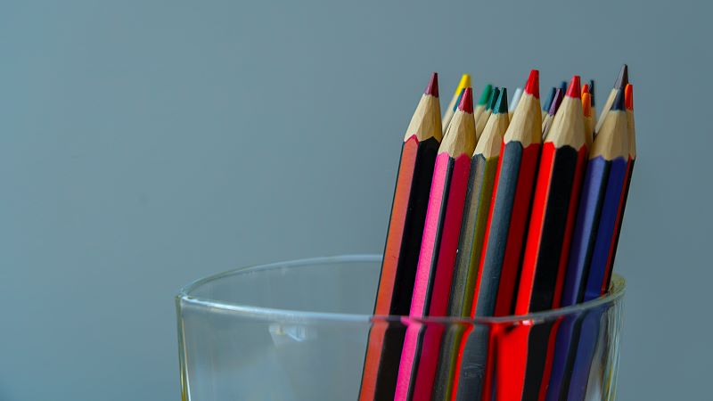 coloured pencils in a glass