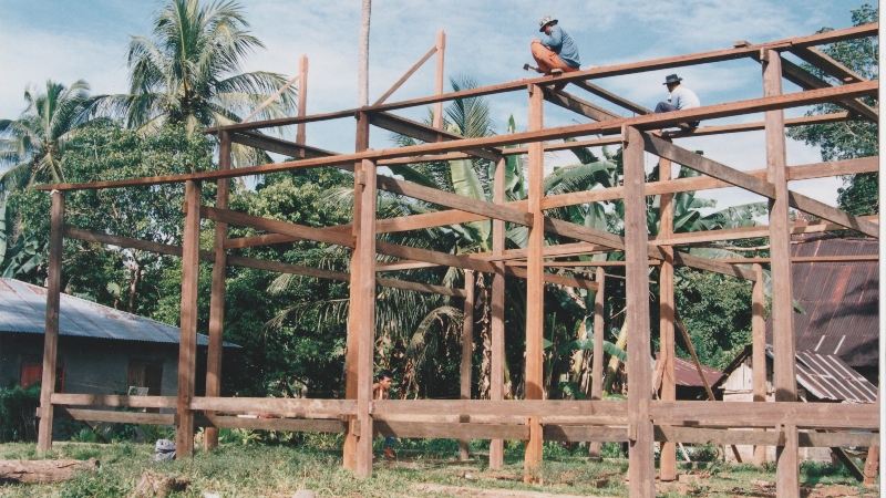 Craftsmen constructing building in Indonesia