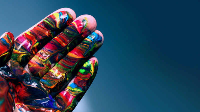 A hand with paint on
